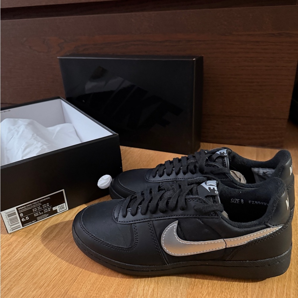 Nike Black Shoes with Metallic Silver Logo